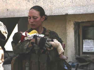 Nicole Gee holding a baby 