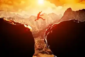 depositphotos
48612283 stock photo man jumping over precipice