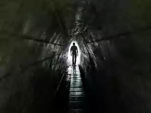 lonely passerby man dark tunnel light end tunnel 406939 4413